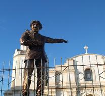 statue of a man near the church