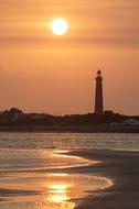 Lighthouse red sun