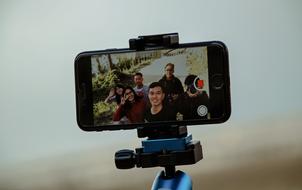 photo of tourists on a smartphone on a blurred background