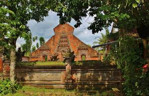 temple in the shade of trees in indonesia