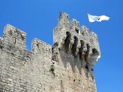white flag on the fortress against the blue sky