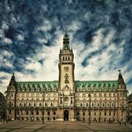 Beautiful and colorful, decorated town hall in Hamburg, Germany, under the blue sky with clouds