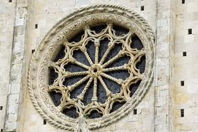 Beautiful, decorated rose window of Duomo in Milan, Italy