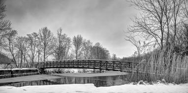 black and white, bridge over the winter river