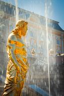 golden sculpture near the fountain in Peterhof