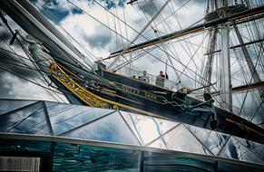 Beautiful, decorated Cutty Sark near the glass in Greenwich, London, England