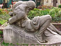 sculpture of a man with tied hands