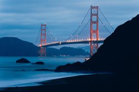 distant view of the bridge as a work of art in the night lights