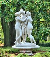 three graces as a marble sculpture in the park