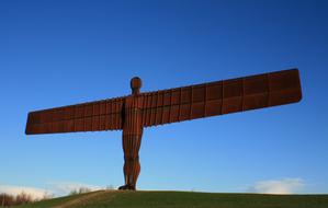 wooden sculpture of an angel with wings