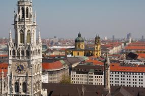 Beautiful, decorated cathedral and buildings with red roofs, in the city