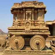 Beautiful, patterned Stone Chariot in Hampi, India, at blue sky on background