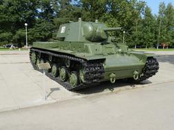 Model of the green tank, of the Red Army, near the green trees