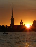 silhouettes of historic architecture at sunset