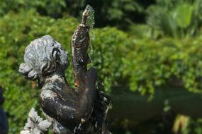 metal sculpture in the fountain in the park