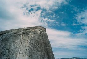 white clouds over a cliff in yosemite