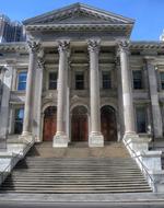 Beautiful Tweed courthouse with columns, at blue sky on background, in New York City, USA