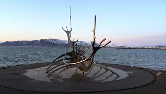 metal modern sculpture on the beach in iceland
