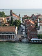 Beautiful cityscape of Venice, with green trees and buildings, among the beautiful water, in Italy