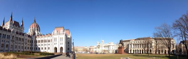 Beautiful and colorful landscape of the parliament, with the park, in Budapest, Hungary, at blue sky on background