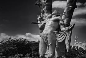 Black and white photo of the beautiful San Sebastian statue in Maracaibo, Venezuela, near the trees