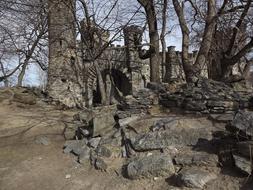 Beautiful, old castle ruins among the trees and stones