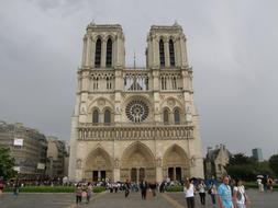 People, near the beautiful architecture with towers in Paris, France