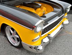 restored orange and grey classic car close-up