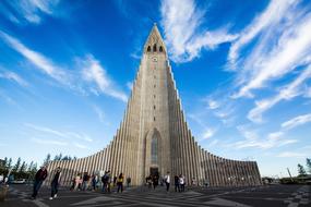 tourists on Hallgrimskirkja background in Reykjavik, Iceland