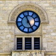 blue stained glass clock on wall