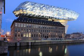 Shiny, colorful office building with the reflections, in Antwerp, Belgium, in the harbor