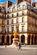 golden statue in the center of paris