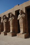 Beautiful Karnak Temple with the statues and columns, in Luxor, Egypt, at blue sky on background