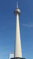 Low angle shot of the beautiful Tv tower in Berlin, Germany, at blue sky with white clouds on background