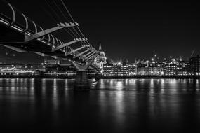 monochrome photo of Millennium Bridge in London