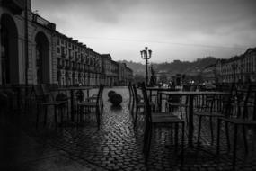 cafe on the square of turin at dusk