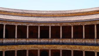 Beautiful, colorful palace with columns in Granada, Andalusia, Spain