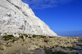 Beautiful, rocky beach of Dover, at blue sky on background, England, UK