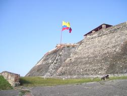 flag on top of a castle in cartagena, Colombia