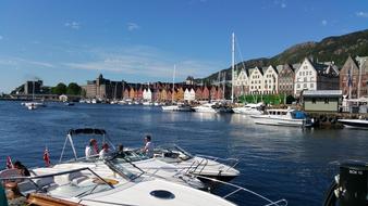 people on boats in the harbor