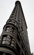 Beautiful Flatiron, at cloudy sky on background, in Manhattan, New York City, USA