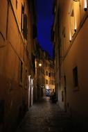 Beautiful street with colorful lights at night in Italy at night