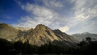 Beautiful and colorful landscape with the Mont Blanc, at blue sky with the clouds on background in Italy