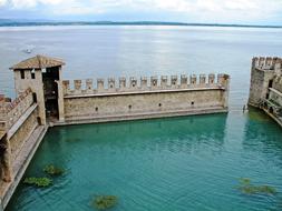 pool with blue water near battlements