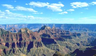 Beautiful landscape with the colorful Grand Canyon, at blue sky with white clouds in America