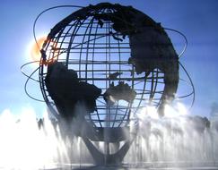 Unisphere, with the fountain, in light, in the park in New York, USA, at blue sky with Sun on background