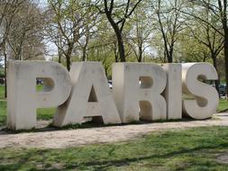 Paris text statue in park