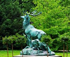 deer and a dog Statue