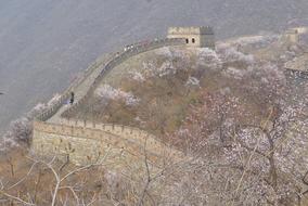 Beautiful landscape with the Great Wall with people on it, on the colorful mountains