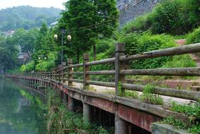 Beautiful shore with the fence, with green plants in Fenghuang, Hunan, China